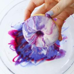 Dunking Shot of Donut into Glaze